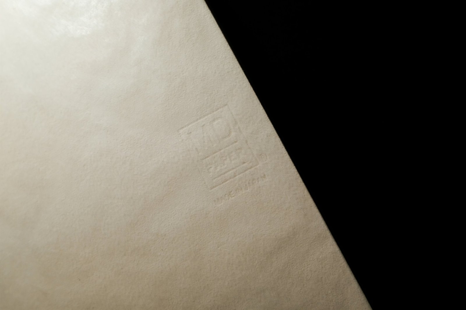 Man holding broken smartwatch and looking frustrated