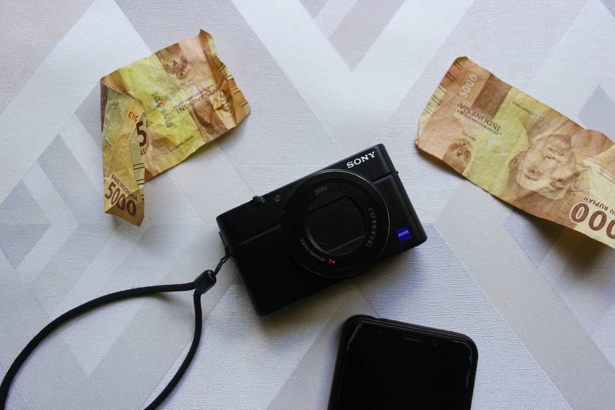 eligible cameras displayed on a desk with credit card and receipt showing extended warranty claim